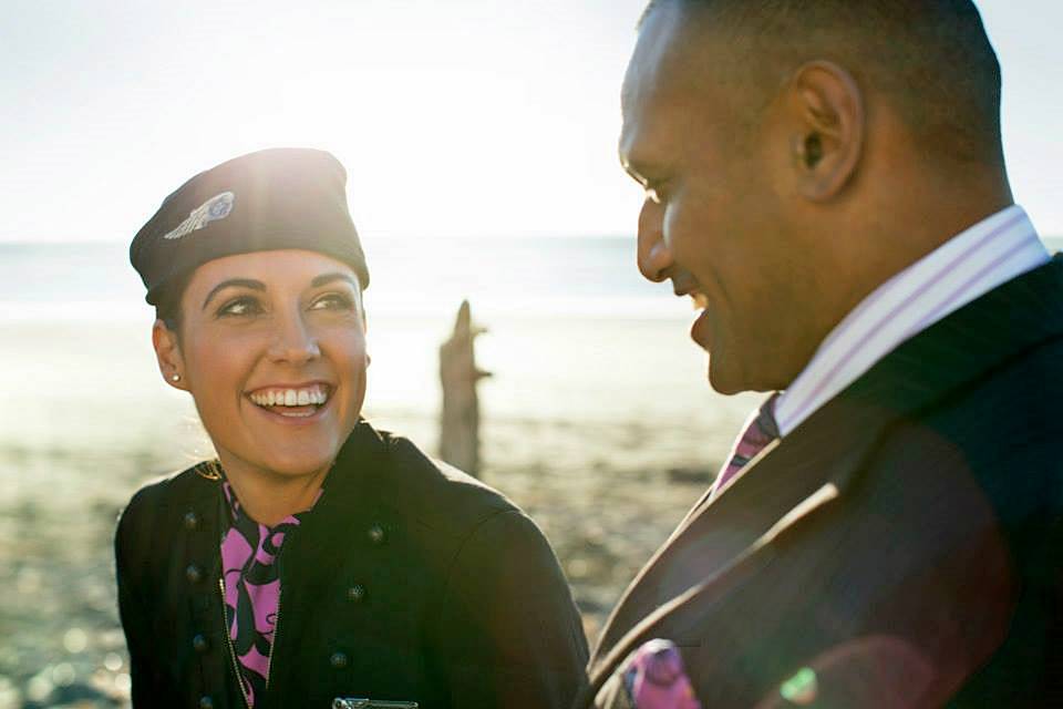 air new zealand male and female flight attendant smile