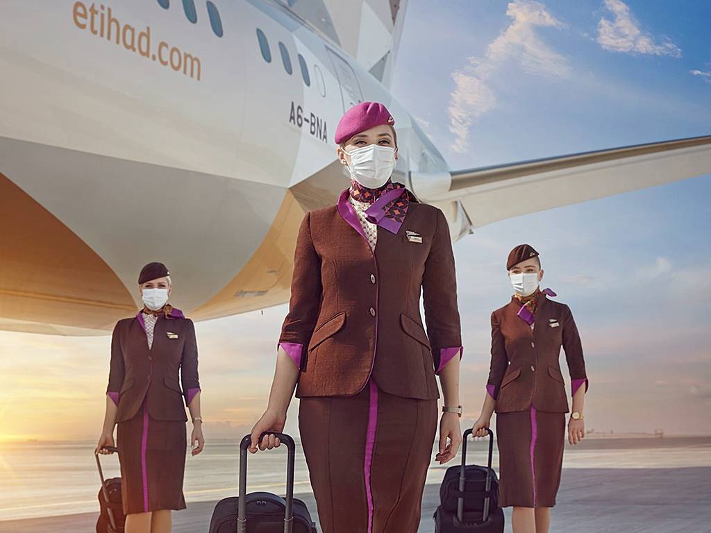 etihad female crew in mask