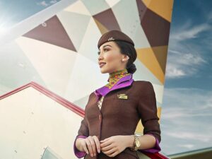 etihad female flight attendant in uniform