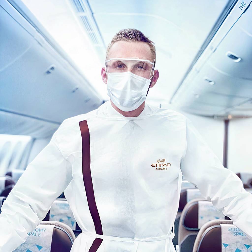etihad male flight attendant in PPE