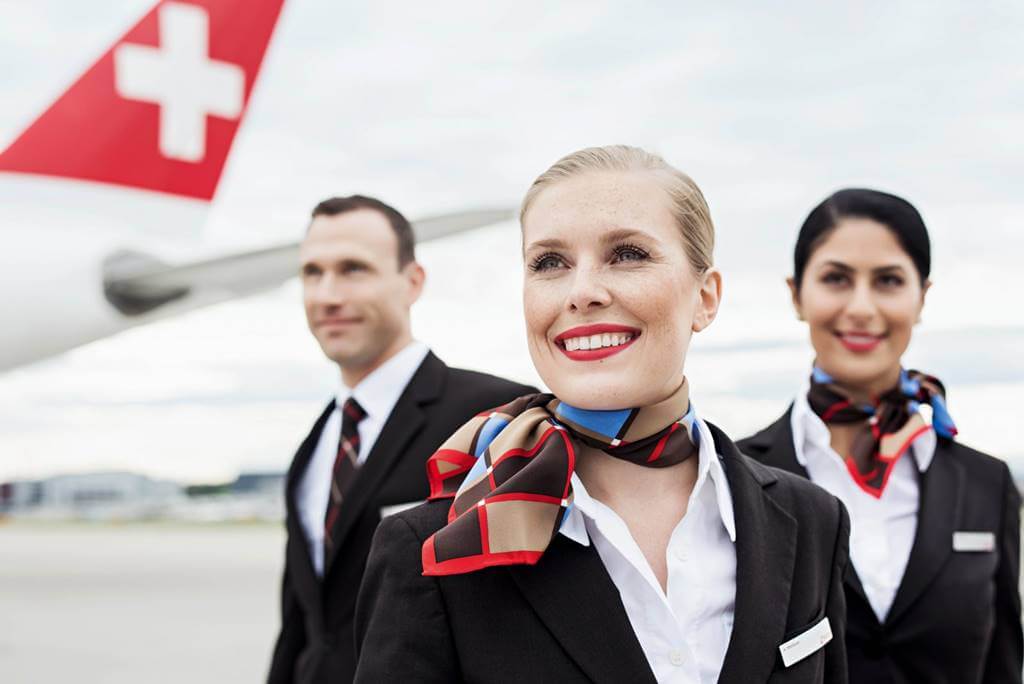 swiss international man and woman flight attendant uniforms