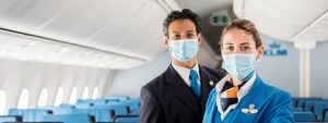 klm male and female crew with masks