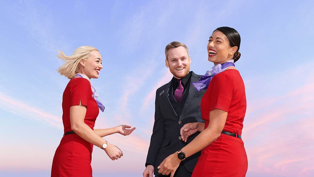 virgin australia male and female flight attendants smile