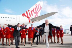 virgin australia male and female flight attendants with richard branson