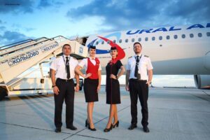 ural airlines female cabin crew with pilot staff