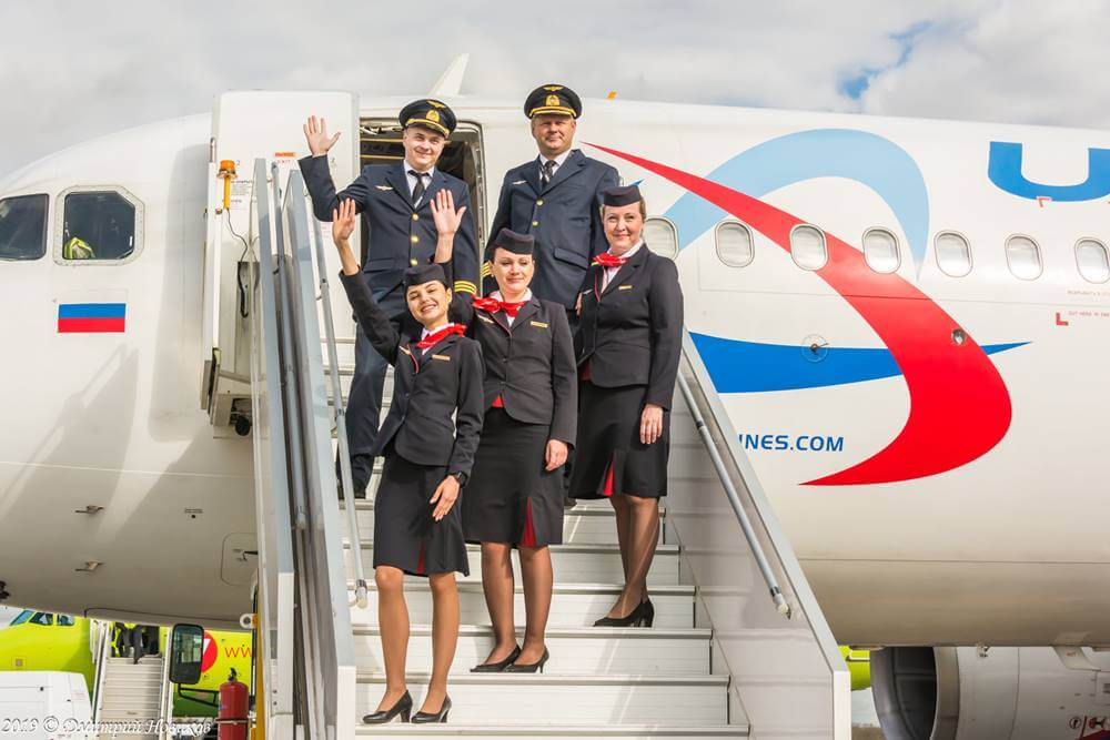 ural airlines female cabin crew with pilots