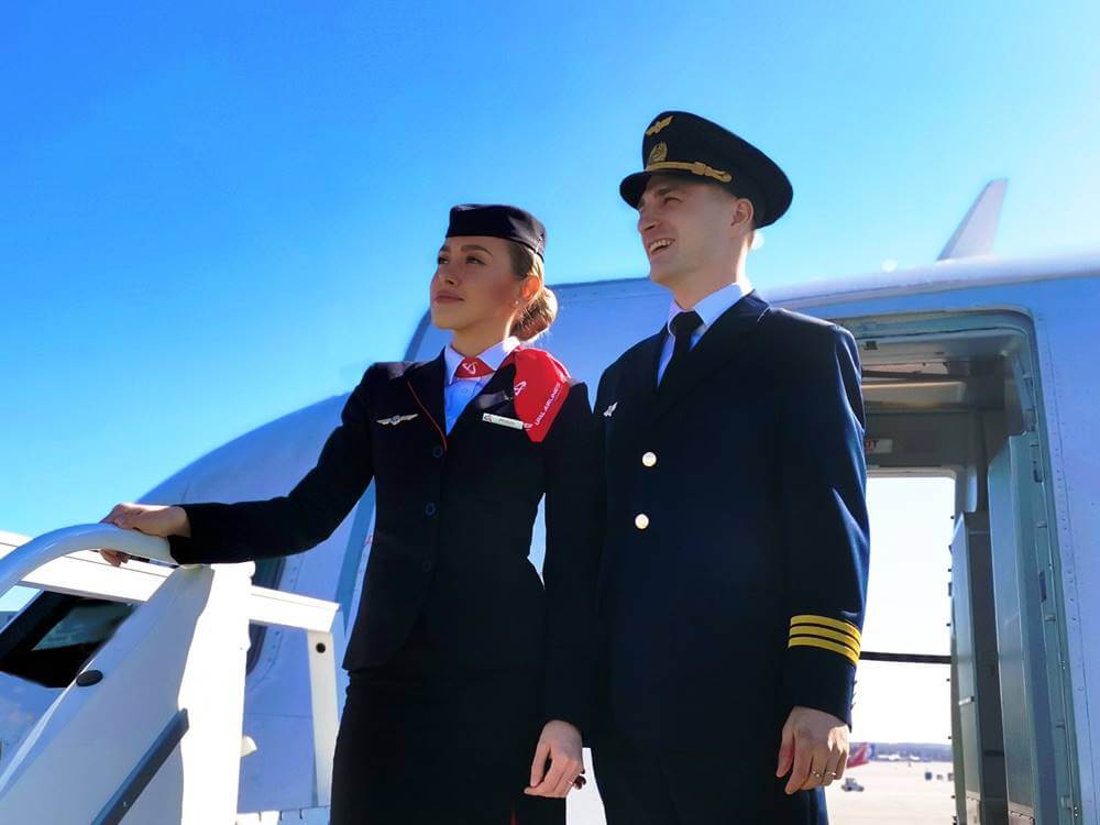 ural airlines female flight attendant with pilot