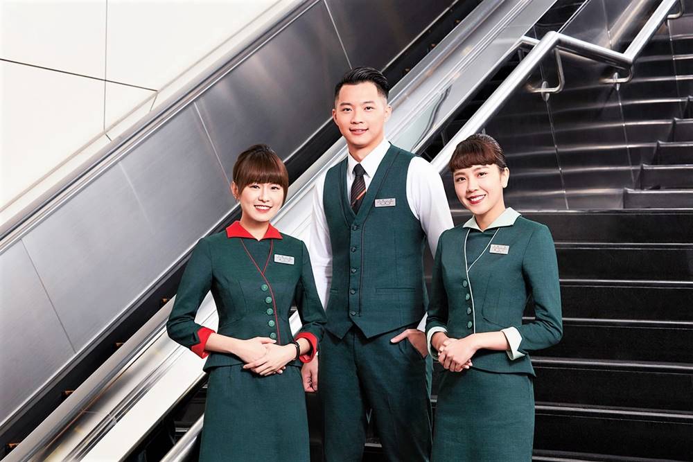 EVA Air male and female flight attendants in uniform