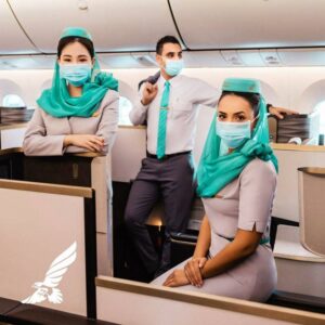 gulf air male and female cabin crew with masks