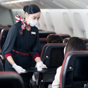 japan airlines female cabin crew inside plane