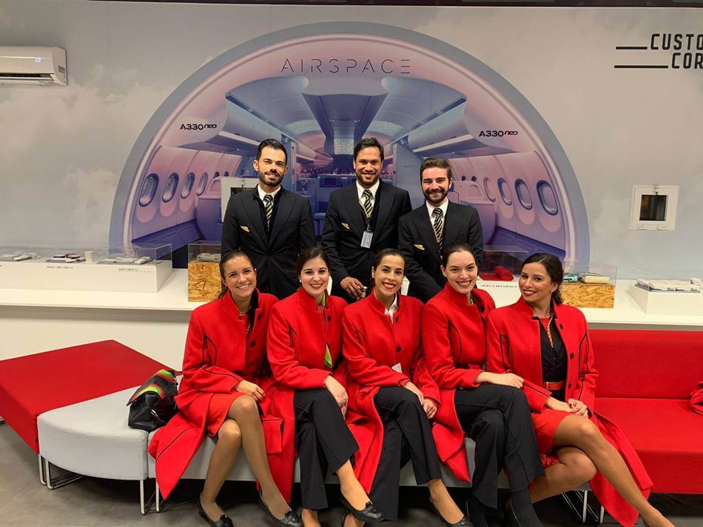 TAP Air Portugal flight attendant male and female smile