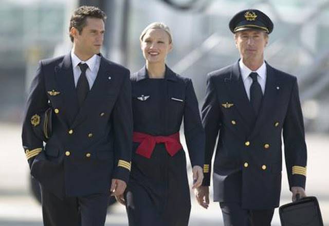 air france female cabin crew with pilots