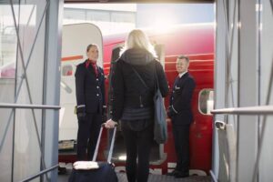 norwegian air flight crew welcome passenger