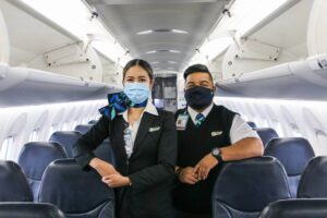 westjet male and female flight attendant