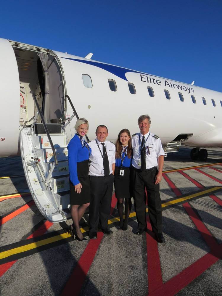 elite airways female blue uniform