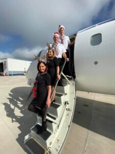 elite airways flight attendants reindeer hat