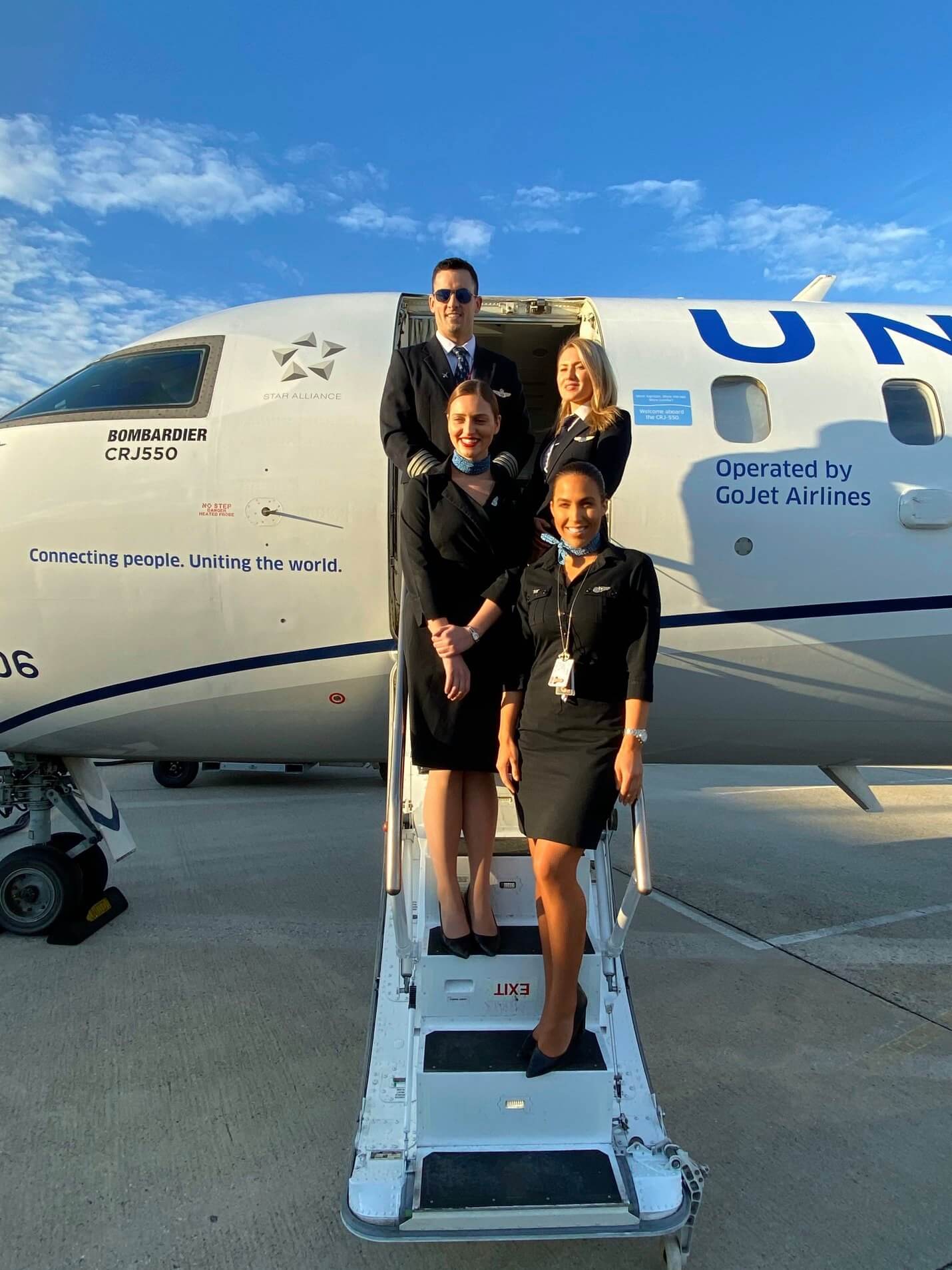 go jet flight attendants with airplane