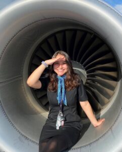 mesa airlines flight attendant with engine background