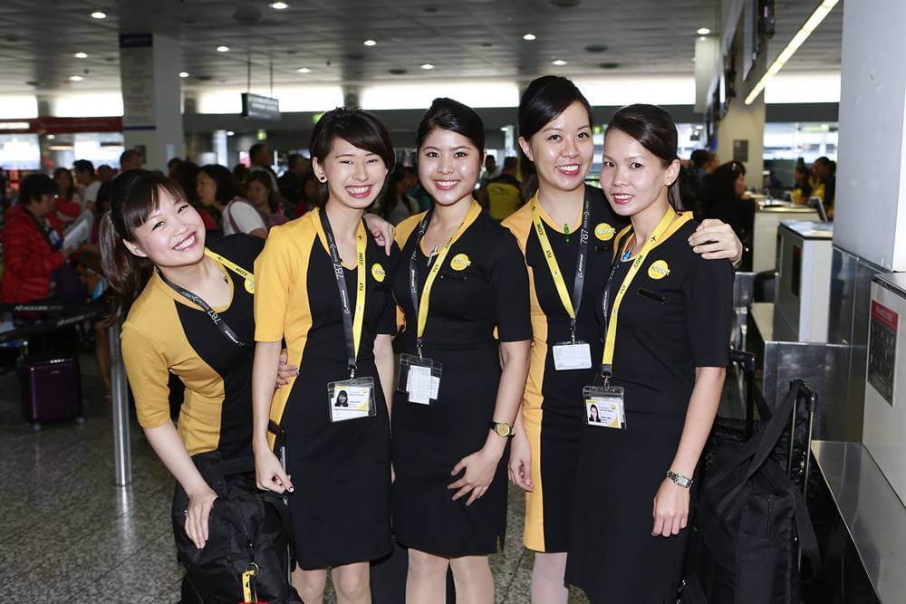 scoot female flight attendants pose
