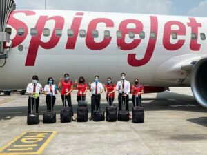 spicejet full uniform in front of airplane