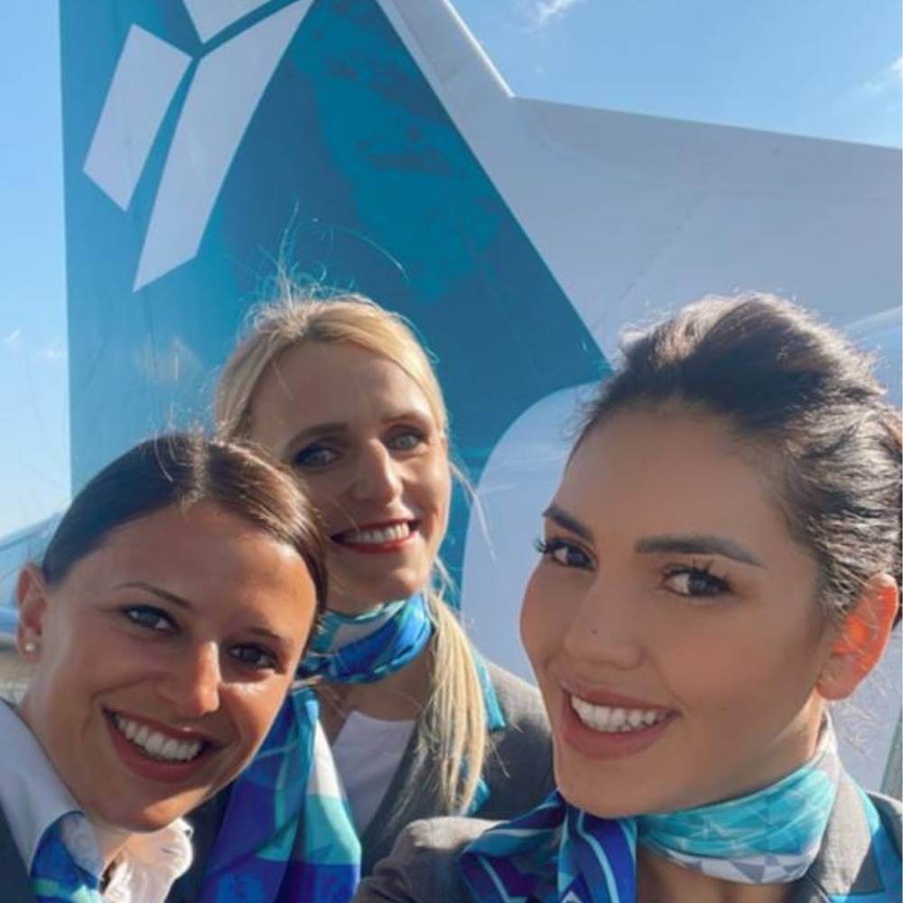 air dolomiti happy female cabin crews