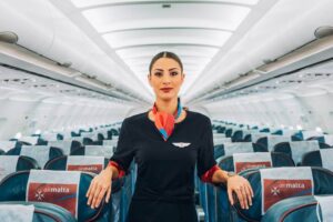 air malta female flight attendant in the cabin