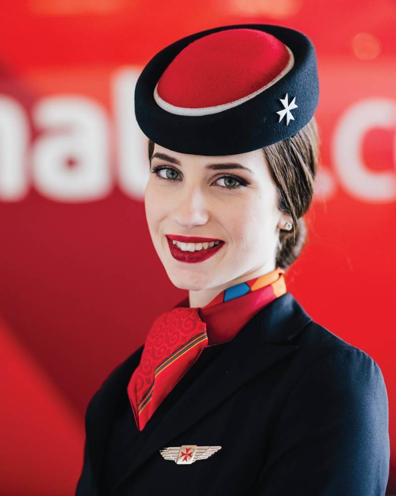 air malta female flight attendant smiling