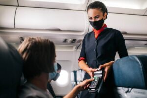 air malta flight attendant taking payment
