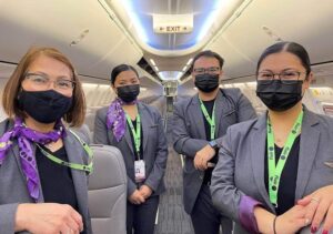 flair airlines male and female flight attendants cabin