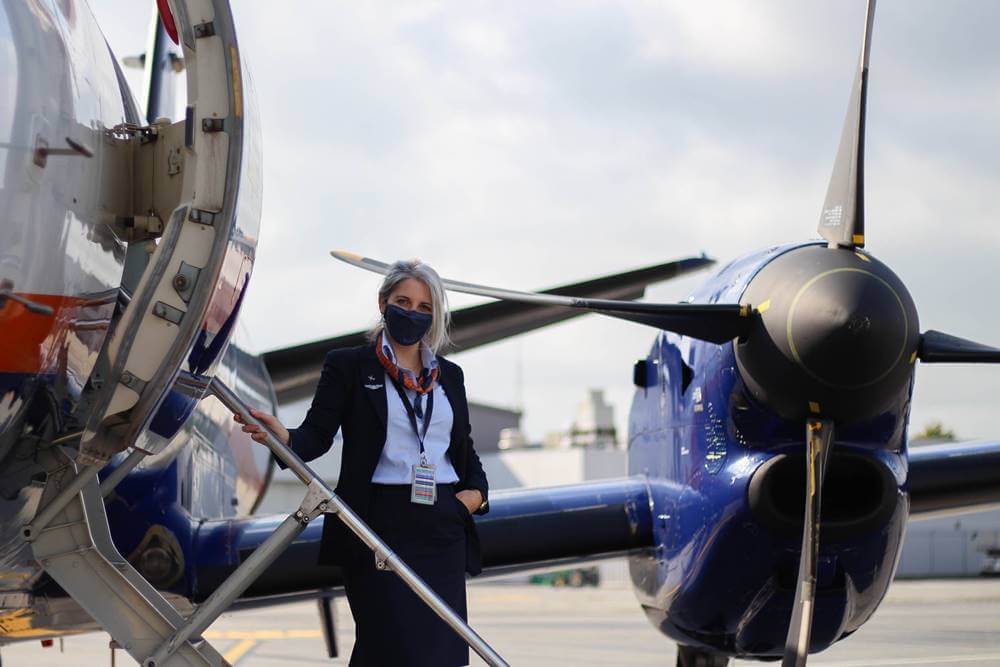 pacific coastal airlines female crew plane