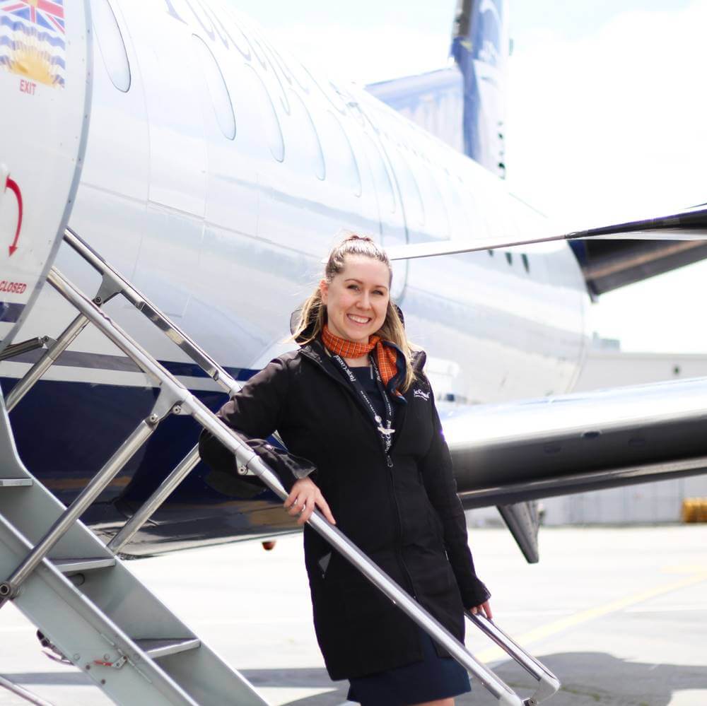 pacific coastal airlines female crew smile
