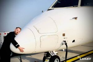 Luxair crew hugging plane