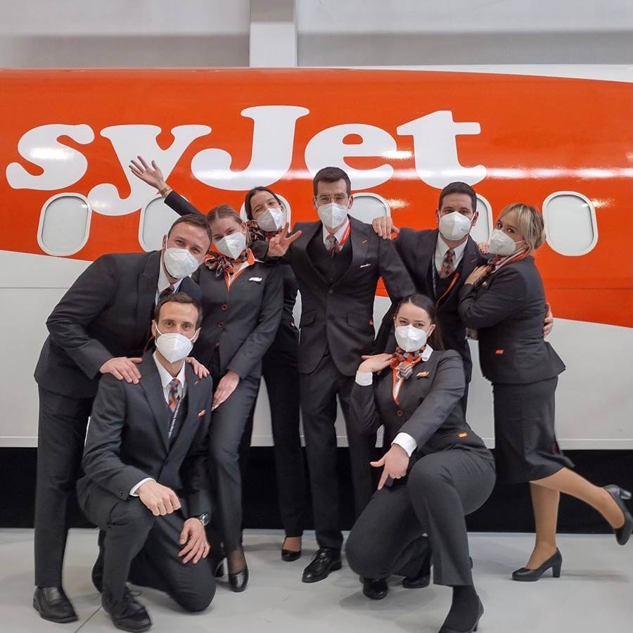 easyjet male and female flight attendants with masks