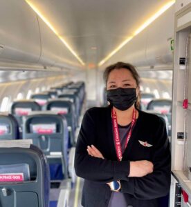 female canadian north cabin crew with mask