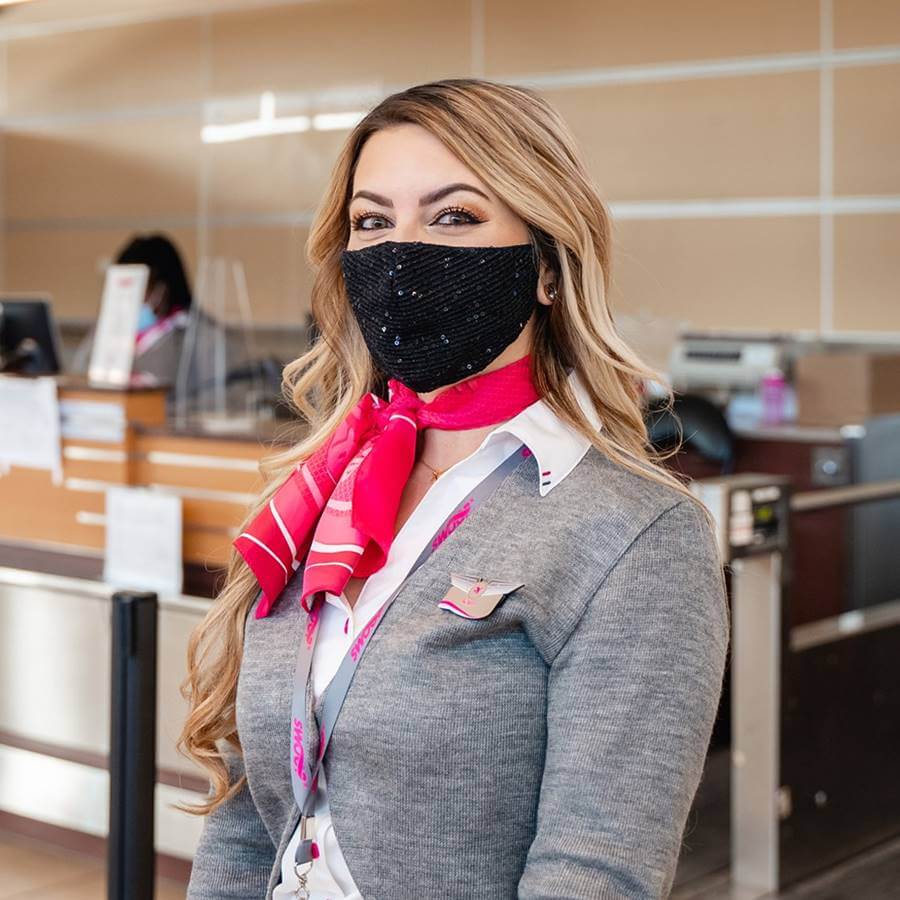 swoop airlines flight attendant with mask