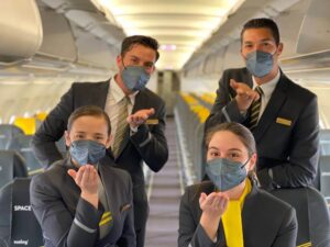 vueling crew blowing kiss