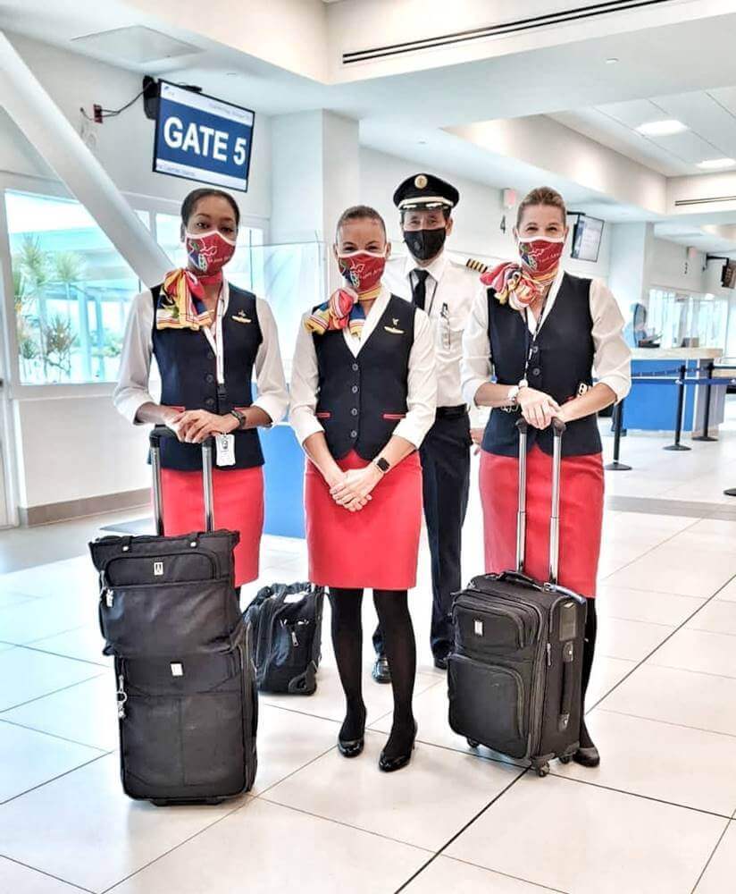 Cayman Airways flight attendants full uniform