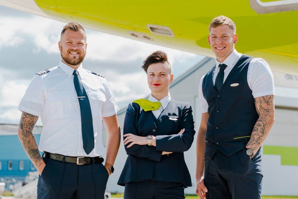 airbaltic crew with tattoo and hairstyle