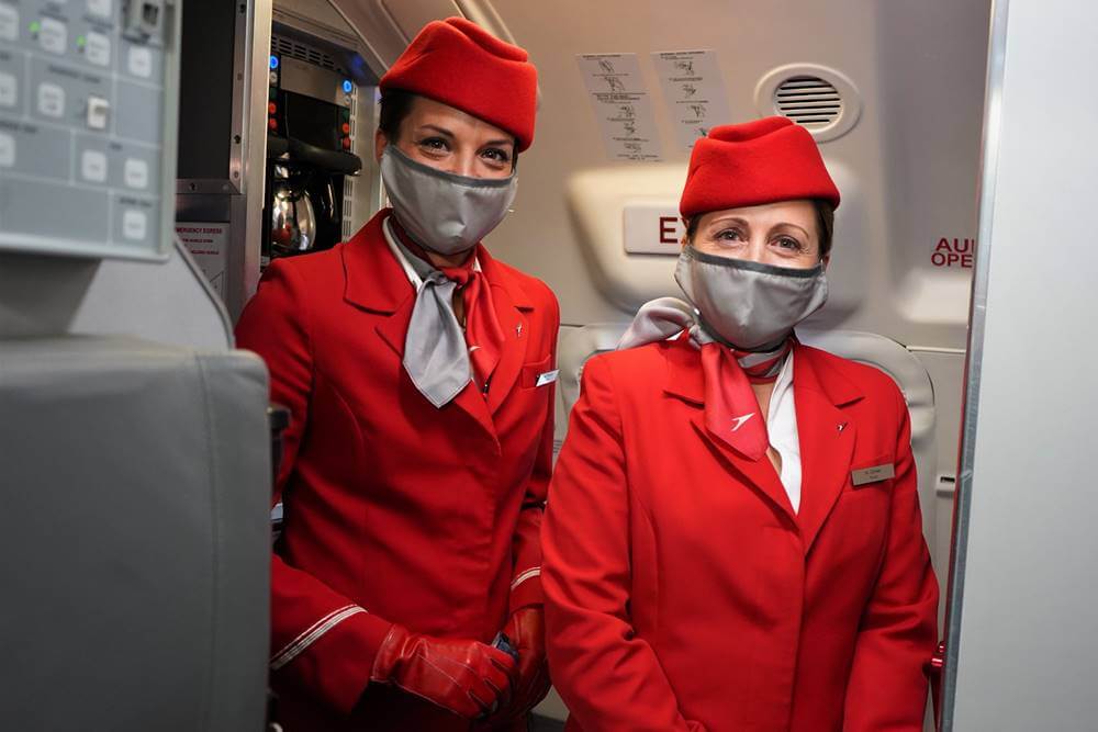 austrian airlines female cabin crew with masks
