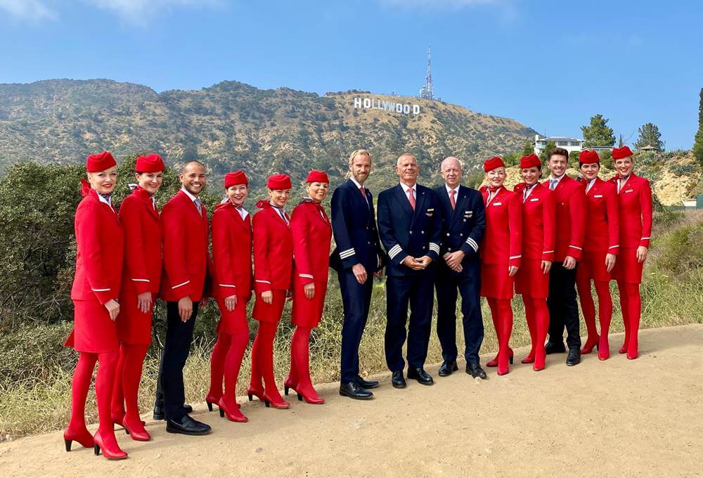 austrian airlines male and female flight attendants with pilots