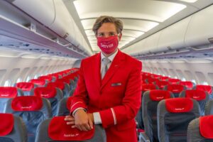 austrian airlines male cabin crew with mask
