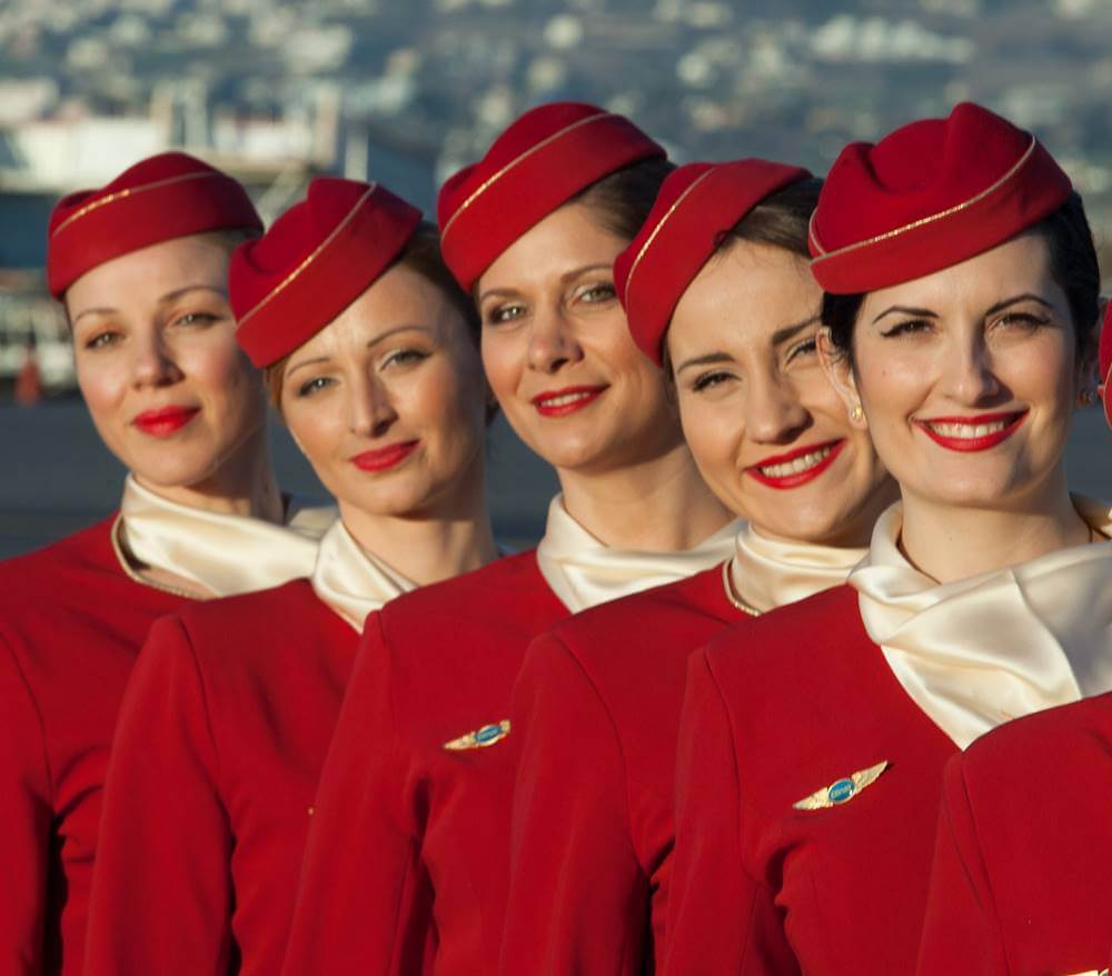 ellinair female flight attendants smile