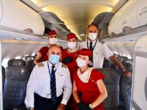 ellinair female flight attendants with pilots