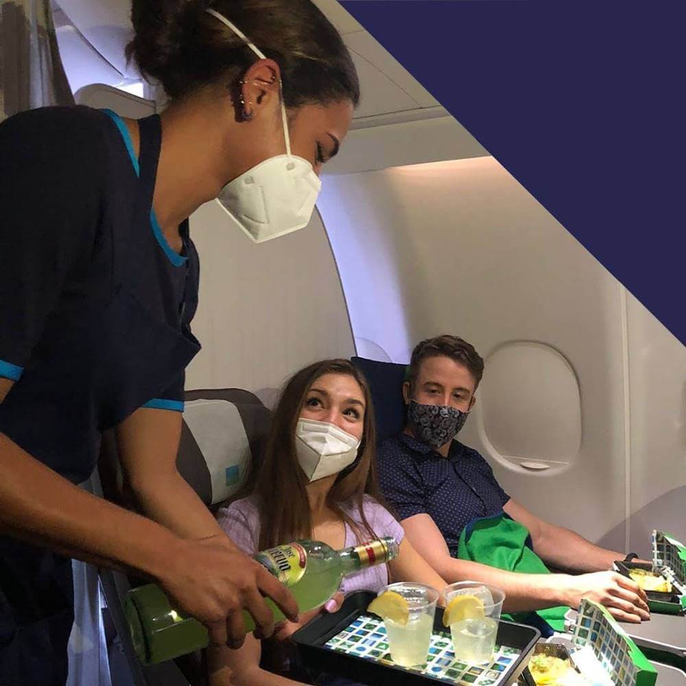 level flight attendant serving passenger