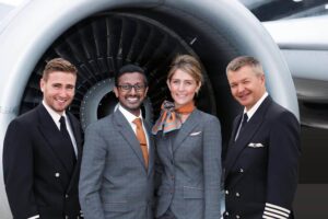 titan airways male and female cabin crew with pilots