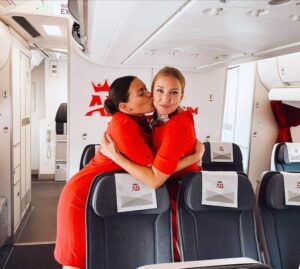 Air Belgium female flight attendants kiss