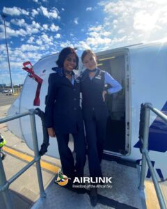 Airlink female cabin crews open door