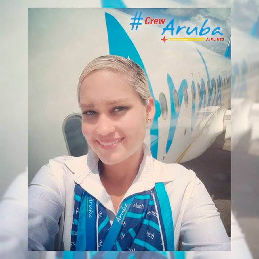 Aruba Airlines female flight attendant fuselage