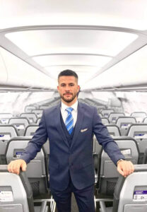 Avion Express male flight attendant boarding