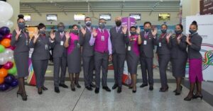 Caribbean Airlines flight attendants check in counter